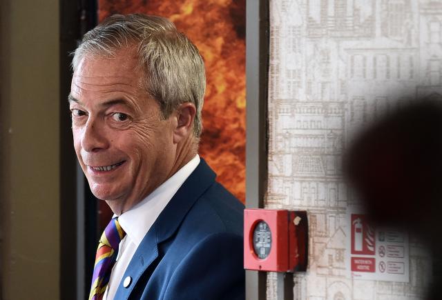 Reform UK leader Nigel Farage reacts during a visit to St Helens, north west England on May 8, 2026, as votes continue to be counted following local elections. Nigel Farage, leader of the Britain's hard-right nationalist Reform UK party, vowed Friday it was "here to stay" after winning hundreds of seats in local polls. (Photo by PETER POWELL / AFP)