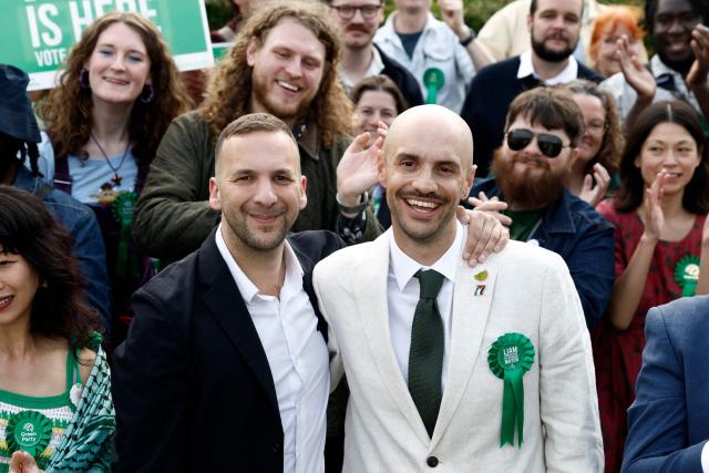 Green Party leader Zack Polanski (L) congratulates the party's newly elected Mayor of Lewisham, Liam Shrivastava, outside the count centre in Lewisham, south London on May 8, 2026. Nigel Farage's anti-immigrant Reform UK and the left-wing Greens, led by self-described eco-populist Zack Polanski, werw expected to benefit from widespread disillusionment. (Photo by Brook Mitchell / AFP)