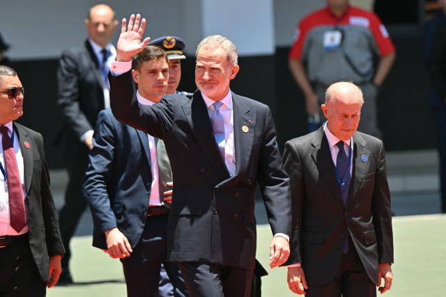 Spain's King Felipe VI waves as he arrives for the inauguration ceremony of Costa Rica's president-elect Laura Fernandez at the National Stadium in San Jose on May 8, 2026. (Photo by MARTIN BERNETTI / AFP)