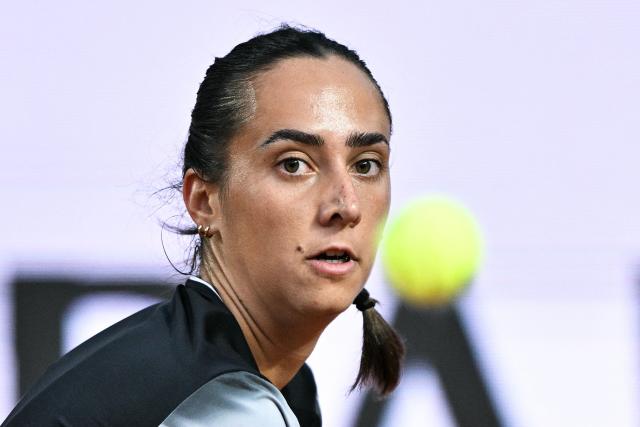 GuestItaly's Noemi Basiletti hits a backhand to Ukraine's Elina Svitolina during their women's singles match of the WTA Rome Open tennis tournament at the Foro Italico in Rome on May 8, 2026. (Photo by Tiziana FABI / AFP)