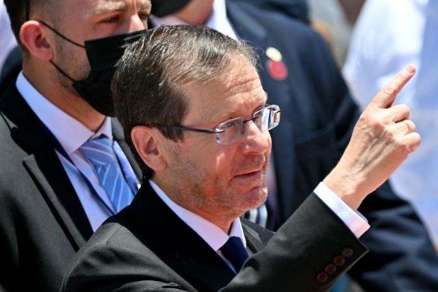 Israel's President Isaac Herzog gestures as he arrives for the inauguration ceremony of Costa Rica's president-elect Laura Fernandez, at the National Stadium in San Jose, on May 8, 2026. Costa Rican political scientist Laura Fernandez will be inaugurated as president on May 8, 2026, the latest right-winger to win power in Latin America on a promise to combat drug-related violence. (Photo by MARTIN BERNETTI / AFP)
