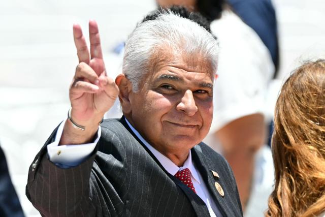 Panama's President Jose Raul Mulino flashes the V sign as he arrives for the inauguration ceremony of Costa Rica's president-elect Laura Fernandez at the National Stadium in San Jose on May 8, 2026. (Photo by MARTIN BERNETTI / AFP)