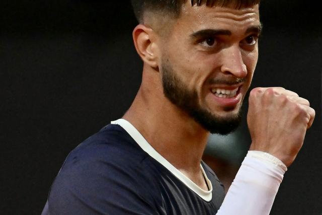 Croatia's Dino Prizmic reacts as he plays against Serbia's Novak Djokovic during their men's singles match of the WTA Rome Open tennis tournament at the Foro Italico in Rome on May 8, 2026. (Photo by Filippo MONTEFORTE / AFP)