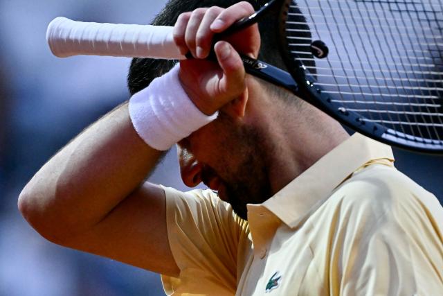 Serbia's Novak Djokovic reacts as he plays against Croatia's Dino Prizmic during their men's singles match of the WTA Rome Open tennis tournament at the Foro Italico in Rome on May 8, 2026. (Photo by Filippo MONTEFORTE / AFP)