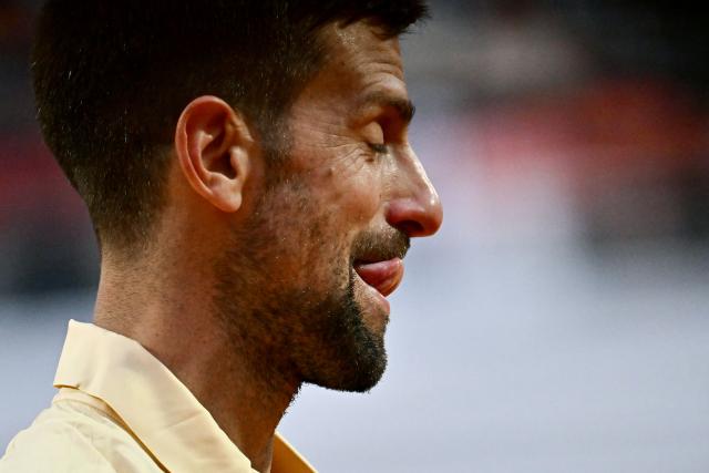 Serbia's Novak Djokovic reacts as he plays against Croatia's Dino Prizmic during their men's singles match of the WTA Rome Open tennis tournament at the Foro Italico in Rome on May 8, 2026. (Photo by Filippo MONTEFORTE / AFP)