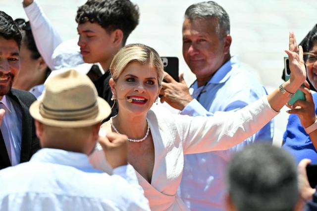 Costa Rica's incoming President Laura Fernandez waves as she arrives for her inauguration ceremony at the National Stadium in San Jose, on May 8, 2026. Costa Rican political scientist Laura Fernandez will be inaugurated as president, the latest right-winger to win power in Latin America on a promise to combat drug-related violence. (Photo by MARTIN BERNETTI / AFP)
