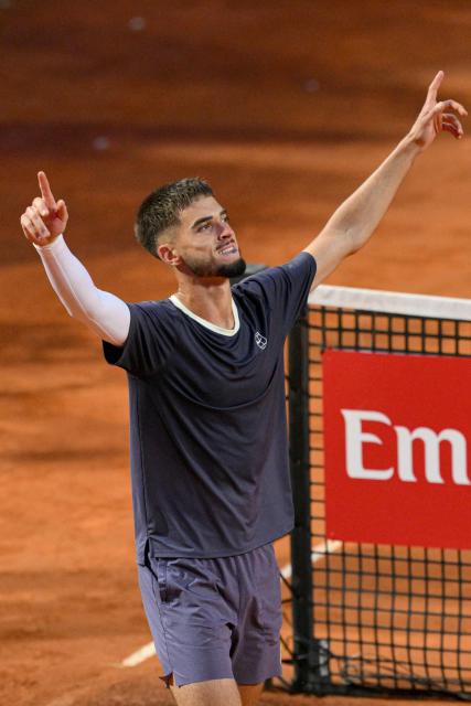 Croatia's Dino Prizmic celebrates after winning against Serbia's Novak Djokovic in their men's singles match of the WTA Rome Open tennis tournament at the Foro Italico in Rome on May 8, 2026. (Photo by Tiziana FABI / AFP)