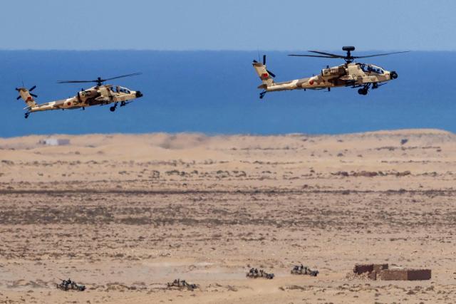 Moroccan Apache helicopters take part in the "African Lion" joint military exercise between US and Moroccan forces in the Tan-Tan region in southwestern Morocco on May 8, 2026. (Photo by Abdel Majid BZIOUAT / AFP)