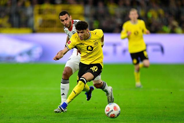 Dortmund's Italian forward #40 Samuele Inacio (R) and Frankfurt's Tunisian midfielder #15 Ellyes Skhiri vie for the ball during the German first division Bundesliga football match between BVB Borussia Dortmund and Eintracht Frankfurt in Dortmund, western Germany on May 8, 2026. (Photo by INA FASSBENDER / AFP) / DFL REGULATIONS PROHIBIT ANY USE OF PHOTOGRAPHS AS IMAGE SEQUENCES AND/OR QUASI-VIDEO