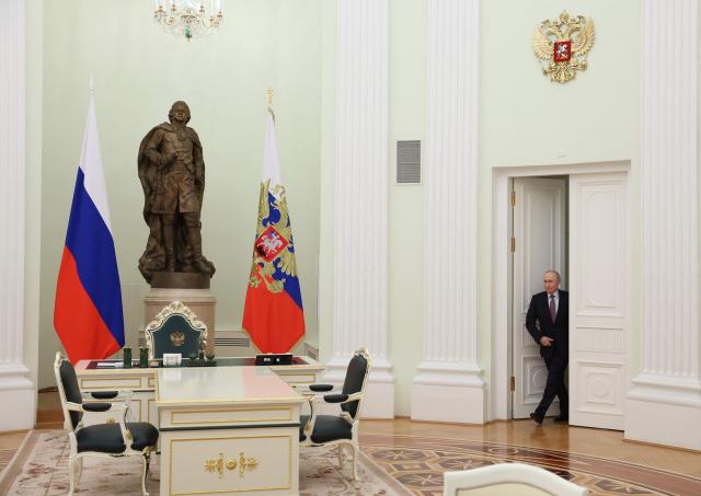 Russian President Vladimir Putin arrives for a meeting with Belarusian President at the Kremlin in Moscow on May 8, 2026. (Photo by Ramil Sitdikov / POOL / AFP)