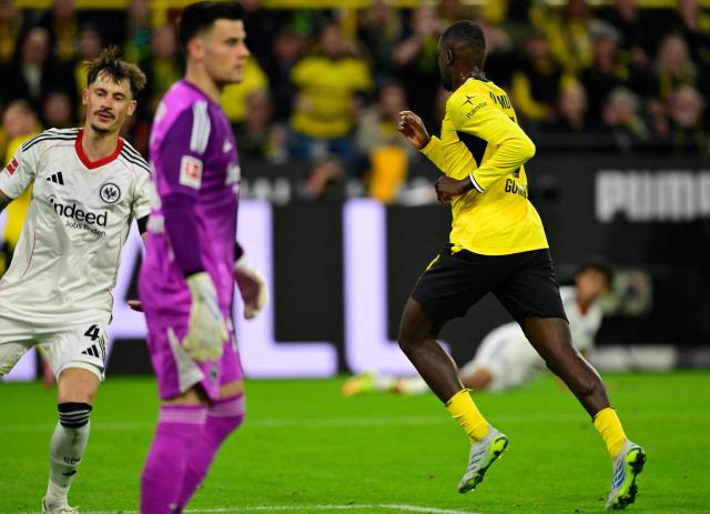 Dortmund's Guinean forward #09 Serhou Guirassy celebrates scoring the 1-1 goal during the German first division Bundesliga football match between BVB Borussia Dortmund and Eintracht Frankfurt in Dortmund, western Germany on May 8, 2026. (Photo by INA FASSBENDER / AFP) / DFL REGULATIONS PROHIBIT ANY USE OF PHOTOGRAPHS AS IMAGE SEQUENCES AND/OR QUASI-VIDEO