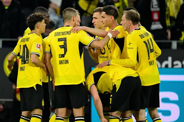 Dortmund's Guinean forward #09 Serhou Guirassy (2nd L) celebrates scoring the 1-1 goal with his teammates during the German first division Bundesliga football match between BVB Borussia Dortmund and Eintracht Frankfurt in Dortmund, western Germany on May 8, 2026. (Photo by INA FASSBENDER / AFP) / DFL REGULATIONS PROHIBIT ANY USE OF PHOTOGRAPHS AS IMAGE SEQUENCES AND/OR QUASI-VIDEO