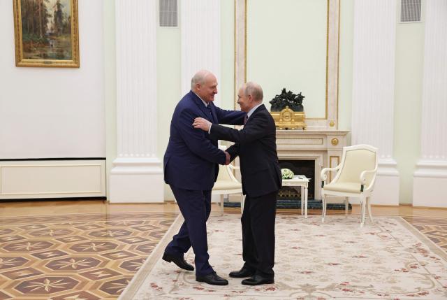 Russian President Vladimir Putin welcomes Belarusian President Alexander Lukashenko during a meeting at the Kremlin in Moscow on May 8, 2026. (Photo by Ramil Sitdikov / POOL / AFP)