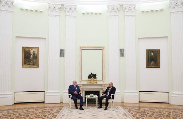 Russian President Vladimir Putin and Belarusian President Alexander Lukashenko attend a meeting at the Kremlin in Moscow on May 8, 2026. (Photo by Ramil Sitdikov / POOL / AFP)