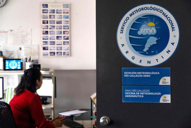 A sign of the Argentine National Meteorological Service (SMN) is pictured at the SMN office in the Piloto Civil Norberto Fernandez International Airport in Rio Gallegos, Santa Cruz province, Argentina on May 6, 2026. (Photo by WALTER DIAZ / AFP)