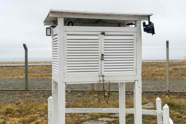 A view of the instrument shelter of the Argentine National Meteorological Service (SMN) at the observation field of the meteorological station, next to the Piloto Civil Norberto Fernandez International Airport, in Rio Gallegos, Santa Cruz province, Argentina on May 6, 2026. (Photo by WALTER DIAZ / AFP)