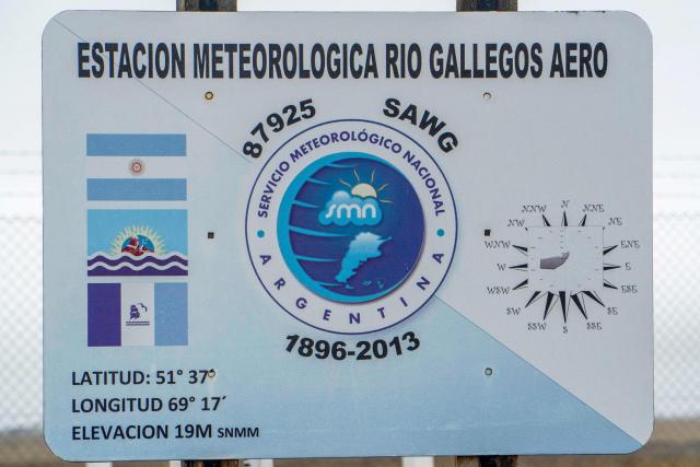 A sign of the meteorological station of the Argentine National Meteorological Service (SMN) is pictured next to the Piloto Civil Norberto Fernandez International Airport in Rio Gallegos, Santa Cruz province, Argentina on May 6, 2026. (Photo by WALTER DIAZ / AFP)
