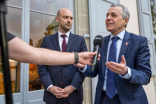 Switzerland's Foreign Affairs Minister and Federal councillor Ignazio Cassis (L) answers questions from journalist next to France's Foreign Affairs Minister Jean-Noel Barrot during their bilateral meeting between Switzerland and France of the G7 countries in preparation of the upcoming June 2026 Evian summit of heads of State and government, in Geneva on May 8, 2026. (Photo by MARTIAL TREZZINI / POOL / AFP)