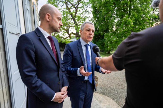 Switzerland's Foreign Affairs Minister and Federal councillor Ignazio Cassis (L) answers questions from journalist next to France's Foreign Affairs Minister Jean-Noel Barrot during their bilateral meeting between Switzerland and France of the G7 countries in preparation of the upcoming June 2026 Evian summit of heads of State and government, in Geneva on May 8, 2026. (Photo by MARTIAL TREZZINI / POOL / AFP)