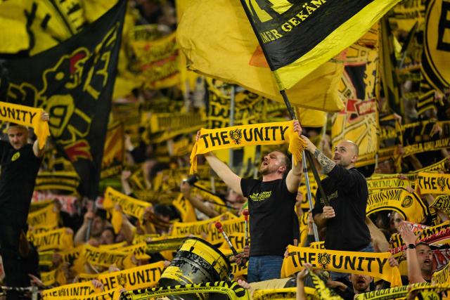Dortmund fan cheer on their team during the German first division Bundesliga football match between BVB Borussia Dortmund and Eintracht Frankfurt in Dortmund, western Germany on May 8, 2026. (Photo by INA FASSBENDER / AFP) / DFL REGULATIONS PROHIBIT ANY USE OF PHOTOGRAPHS AS IMAGE SEQUENCES AND/OR QUASI-VIDEO