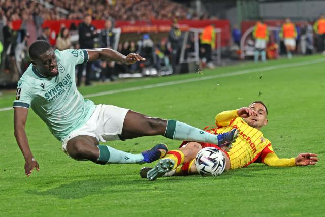 Lens' French defender #02 Ruben Aguilar (R) and Nantes' French midfielder #21 Mohamed Kaba fight for the ball during the French L1 football match between RC Lens and FC Nantes at the Stade Bollaert-Delelis stadium in Lens on May 8, 2026. (Photo by Francois LO PRESTI / AFP)