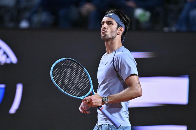Italy's Lorenzo Musetti reacts after winning a point against France's Giovanni Mpetshi Perricard during their men's singles match of the WTA Rome Open tennis tournament at the Foro Italico in Rome on May 8, 2026. (Photo by Tiziana FABI / AFP)