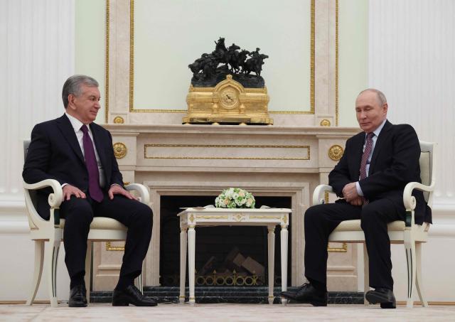 Russian President Vladimir Putin and Uzbek President Shavkat Mirziyoyev attend a meeting at the Kremlin in Moscow on May 8, 2026. (Photo by Ramil Sitdikov / POOL / AFP)