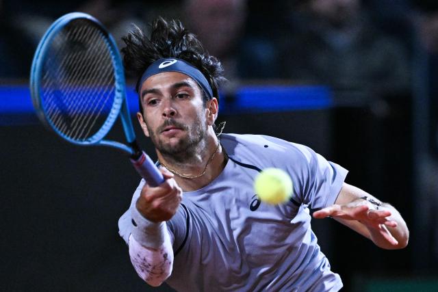 Italy's Lorenzo Musetti hits a return against France's Giovanni Mpetshi Perricard during their men's singles match of the WTA Rome Open tennis tournament at the Foro Italico in Rome on May 8, 2026. (Photo by Tiziana FABI / AFP)