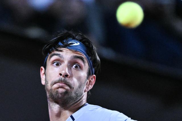Italy's Lorenzo Musetti eyes the ball before hitting a return against France's Giovanni Mpetshi Perricard during their men's singles match of the WTA Rome Open tennis tournament at the Foro Italico in Rome on May 8, 2026. (Photo by Tiziana FABI / AFP)