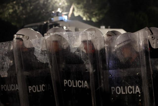 Albanian riot police officers stand by during an anti-government protest in Tirana on May 8, 2026. (Photo by Adnan Beci / AFP)