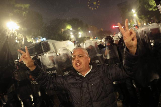 A demonstration gestures as he clashes with Albanian riot police during an anti-government protest in Tirana on May 8, 2026. (Photo by Adnan Beci / AFP)