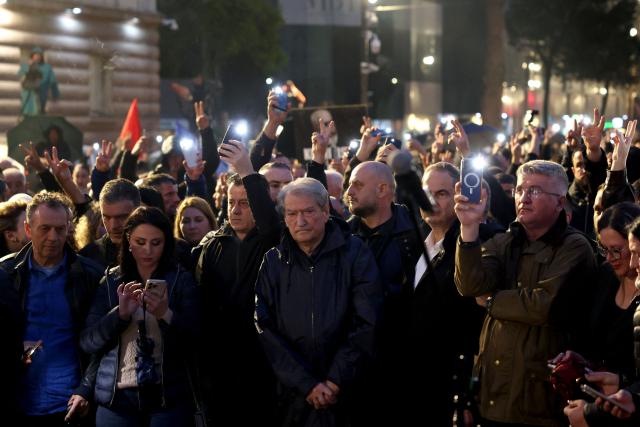 Albanian opposition leader Sali Berisha (C) stands with his supporters in front of the Prime Minister office during an anti-government protest in Tirana on May 8, 2026. (Photo by Adnan Beci / AFP)