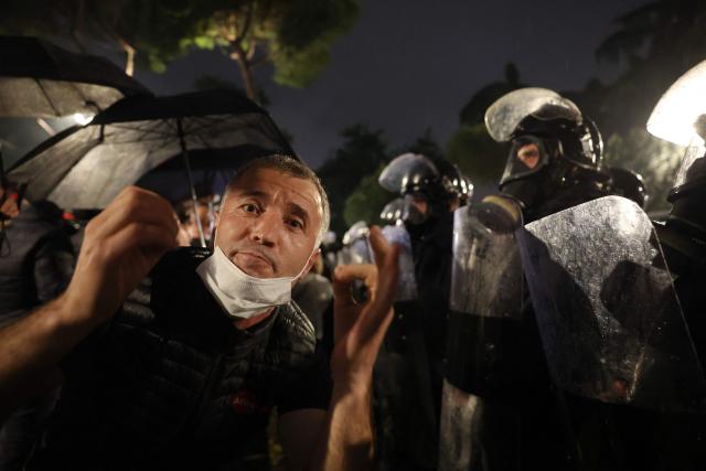 A demonstrator clashes with Albanian riot police during an anti-government protest in Tirana on May 8, 2026. (Photo by Adnan Beci / AFP)