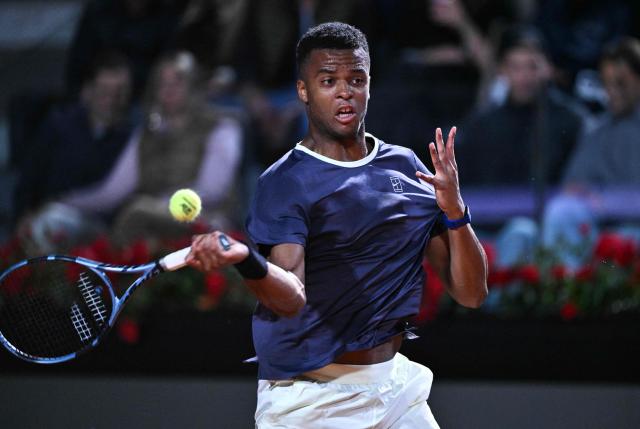 France's Giovanni Mpetshi Perricard hits a forehand against Italy's Lorenzo Musetti during the men's singles match of the WTA Rome Open tennis tournament at the Foro Italico in Rome on May 8, 2026. (Photo by Tiziana FABI / AFP)