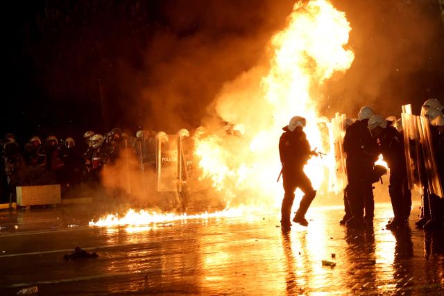 Molotov cocktails explode in front of Albanian riot police officers during an anti-government protest in Tirana on May 8, 2026. (Photo by Adnan Beci / AFP)