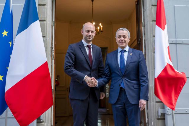 Switzerland's Foreign Affairs Minister and Federal councillor Ignazio Cassis (R) shakes hands with France's Foreign Affairs Minister Jean-Noel Barrot during their bilateral meeting between Switzerland and France of the G7 countries in preparation of the upcoming June 2026 Evian summit of heads of State and government, in Geneva on May 8, 2026. (Photo by MARTIAL TREZZINI / POOL / AFP)