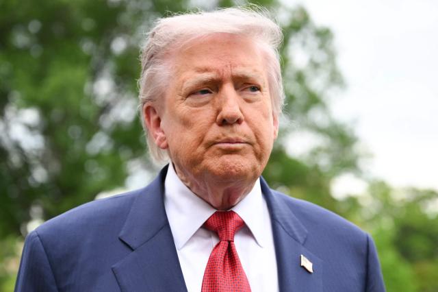 US President Donald Trump speaks to journalists as he makes his way to board Marine One before departing from the South Lawn of the White House in Washington, DC on May 8, 2026. Trump is traveling to Sterling, Virginia, where he will participate in a LIV Golf dinner. (Photo by Mandel NGAN / AFP)