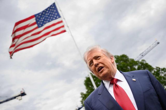 US President Donald Trump speaks to journalists as he makes his way to board Marine One before departing from the South Lawn of the White House in Washington, DC on May 8, 2026. Trump is traveling to Sterling, Virginia, where he will participate in a LIV Golf dinner. (Photo by Mandel NGAN / AFP)