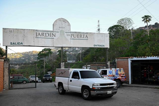 Vehicles of Venezuela's Scientific, Penal and Criminal Investigations Corps (CICPC) leave the Parque Jardin La Puerta cemetery after the exhumation of political prisoner Victor Quero Navas in Caracas on May 8, 2026. Venezuela's prisons ministry on May 7 acknowledged the death in custody of a political prisoner nearly a year after his passing and after his mother spent months searching for him. Victor Hugo Quero Navas, 51, was arrested in January 2025 on terrorism charges, a charge regularly used to lock up dissidents under ousted socialist president Nicolas Maduro. (Photo by Federico PARRA / AFP)