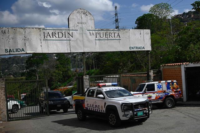 Vehicles of Venezuela's Scientific, Penal and Criminal Investigations Corps (CICPC) leave the Parque Jardin La Puerta cemetery after the exhumation of political prisoner Victor Quero Navas in Caracas on May 8, 2026. Venezuela's prisons ministry on May 7 acknowledged the death in custody of a political prisoner nearly a year after his passing and after his mother spent months searching for him. Victor Hugo Quero Navas, 51, was arrested in January 2025 on terrorism charges, a charge regularly used to lock up dissidents under ousted socialist president Nicolas Maduro. (Photo by Federico PARRA / AFP)