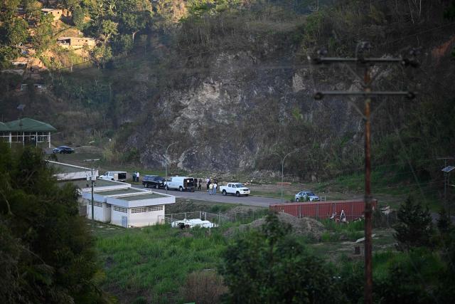 Forensic workers exhume the body of political prisoner Victor Quero Navas at the Parque Jardin La Puerta cemetery in Caracas on May 8, 2026. Venezuela's prisons ministry on May 7 acknowledged the death in custody of a political prisoner nearly a year after his passing and after his mother spent months searching for him. Victor Hugo Quero Navas, 51, was arrested in January 2025 on terrorism charges, a charge regularly used to lock up dissidents under ousted socialist president Nicolas Maduro. (Photo by Federico PARRA / AFP)