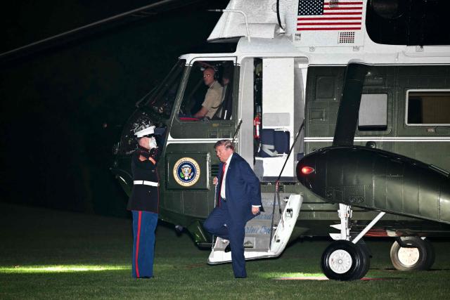 US President Donald Trump steps off of Marine One after landing on the South Lawn of the White House in Washington, DC, on May 8, 2026. Trump is returning to the White House after attending a LIV Golf dinner in Sterling, Virginia. (Photo by Mandel NGAN / AFP)