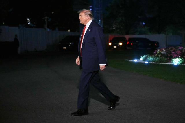 US President Donald Trump walks to the White House after landing on the South Lawn in Washington, DC, on May 8, 2026. Trump is returning to the White House after attending a LIV Golf dinner in Sterling, Virginia. (Photo by Mandel NGAN / AFP)