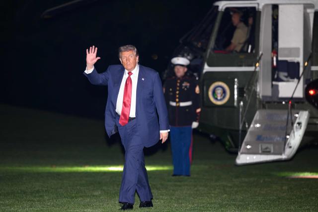 US President Donald Trump waves as he walks across the South Lawn upon returning to the White House in Washington, DC, on May 8, 2026. Trump is returning to the White House after attending a LIV Golf dinner in Sterling, Virginia. (Photo by Mandel NGAN / AFP)