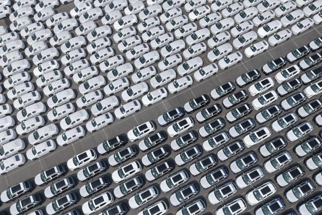 This photo shows an aerial view of new electric vehicles waiting to be loaded for export at Shanghai Port in Shanghai on May 9, 2026. (Photo by CN-STR / AFP) / China OUT