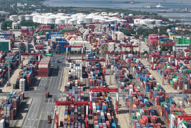 This photo shows an aerial view of the Shanghai Port container terminal for international trade in Shanghai on May 9, 2026. (Photo by CN-STR / AFP) / China OUT