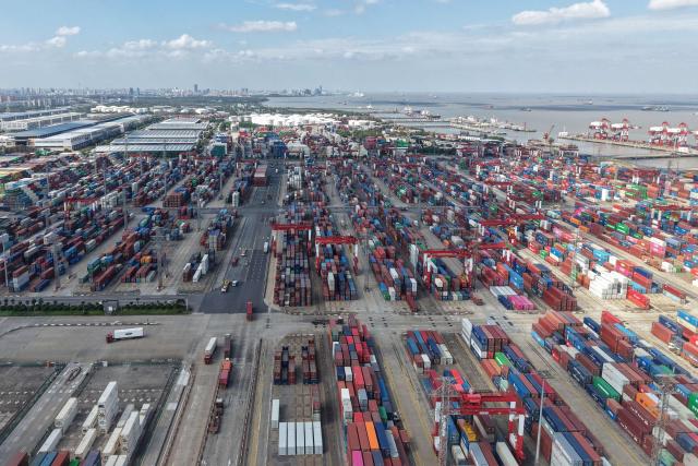 This photo shows an aerial view of the Shanghai Port container terminal for international trade in Shanghai on May 9, 2026. (Photo by CN-STR / AFP) / China OUT