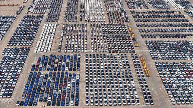 This photo shows an aerial view of cars waiting ot be loaded onto a ship at a storage yard in Yantai, in eastern China's Shandong province on May 9, 2026. (Photo by CN-STR / AFP) / China OUT