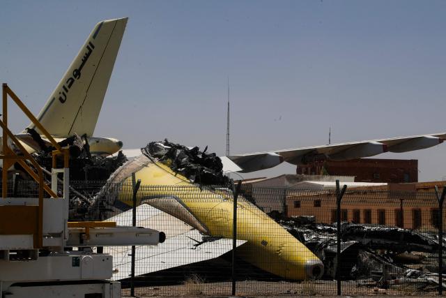 CORRECTION / Heavily damaged aircraft are seen at Khartoum International Airport in Khartoum on April 28, 2026. The civil war in Sudan between the army and the paramilitary Rapid Support Forces has killed tens of thousands of people since April 2023 and displaced more than 12 million people. (Photo by Ebrahim HAMID / AFP) / “The erroneous mention[s] appearing in the metadata of this photo by Ebrahim HAMID has been modified in AFP systems in the following manner: corrects byline to [Ebrahim HAMID] instead of [Khaled DESOUKI]. Please immediately remove the erroneous mention[s] from all your online services and delete it (them) from your servers. If you have been authorized by AFP to distribute it (them) to third parties, please ensure that the same actions are carried out by them. Failure to promptly comply with these instructions will entail liability on your part for any continued or post notification usage. Therefore we thank you very much for all your attention and prompt action. We are sorry for the inconvenience this notification may cause and remain at your disposal for any further information you may require.”