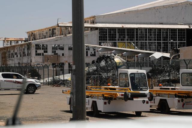 CORRECTION / Heavily damaged aircraft are seen at Khartoum International Airport in Khartoum on April 28, 2026. The civil war in Sudan between the army and the paramilitary Rapid Support Forces has killed tens of thousands of people since April 2023 and displaced more than 12 million people. (Photo by Ebrahim HAMID / AFP) / “The erroneous mention[s] appearing in the metadata of this photo by Ebrahim HAMID has been modified in AFP systems in the following manner: corrects byline to [Ebrahim HAMID] instead of [Khaled DESOUKI]. Please immediately remove the erroneous mention[s] from all your online services and delete it (them) from your servers. If you have been authorized by AFP to distribute it (them) to third parties, please ensure that the same actions are carried out by them. Failure to promptly comply with these instructions will entail liability on your part for any continued or post notification usage. Therefore we thank you very much for all your attention and prompt action. We are sorry for the inconvenience this notification may cause and remain at your disposal for any further information you may require.”